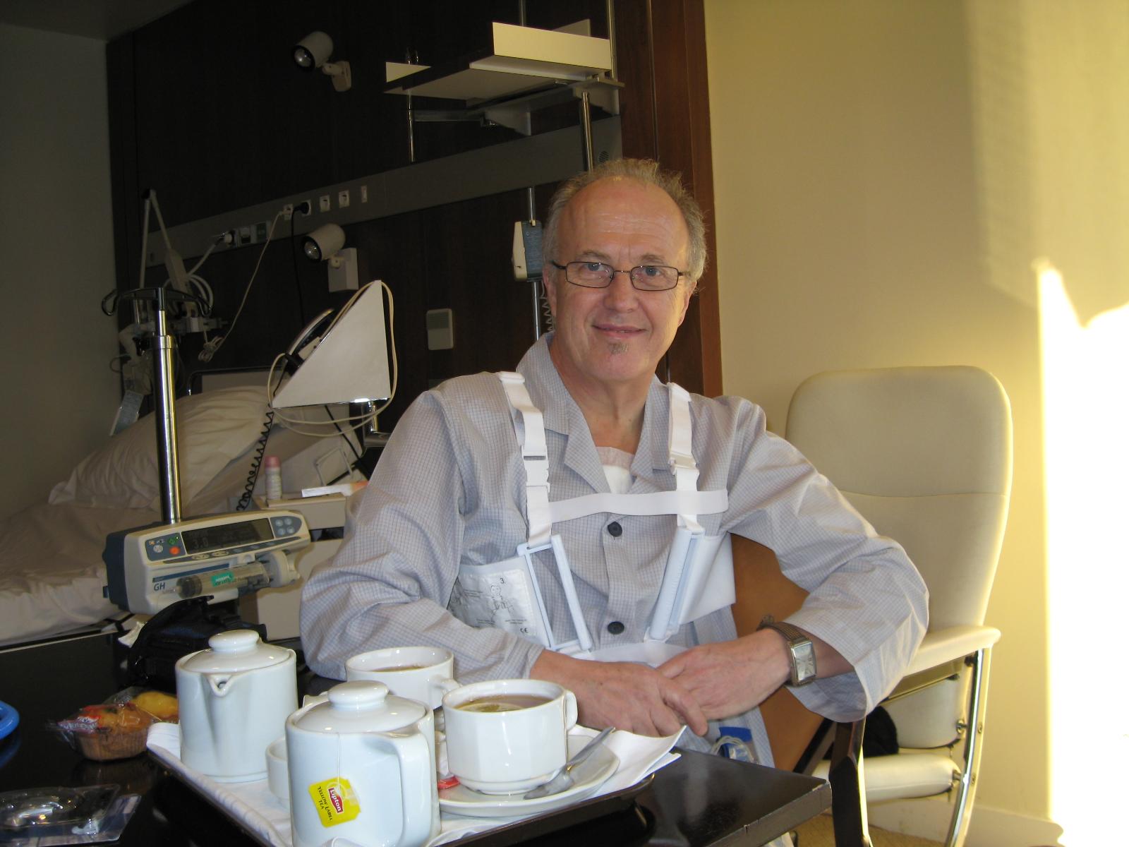 Me in my new Hospital room on the 1st February 2010, four days after the operation. Note the tea, the harness, and the dressing