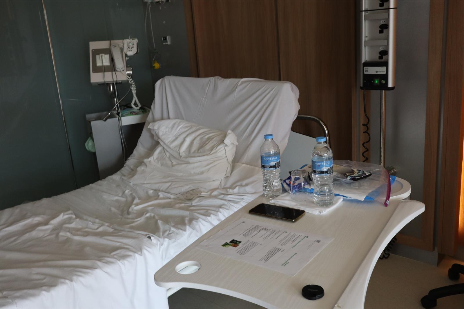 14th September 2022, detail of Hospital room showing my bed(there are two in the room), note the bottles of water to keep up my liquid intake